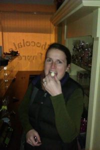 Sarah samples the goods, after getting the keys to Chocolate Fayre